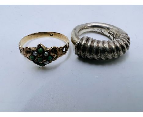 Two rings: A yellow metal seed pearl and turquoise ring, marked 9ct, approximate weight 1.6 grams, size Q, along with a sterl