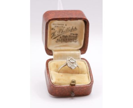 An Art Deco diamond panel ring in white metal, stamped "18ct &amp; PT". Gross weight approximately 2.0 grams. Size K. Length 