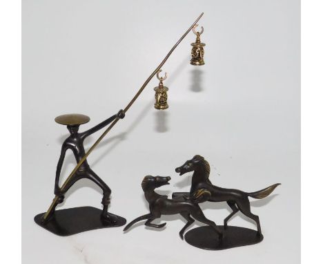 Richard Rohac (1906-1956) An Austrian patinated bronze Asian figure of a fisherman holding a pole with two lanterns, the base