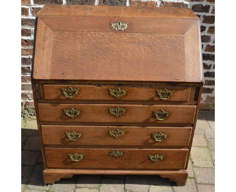 Georgian oak bureau on bracket feet