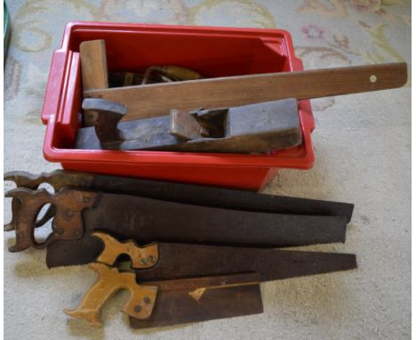 Old tools including a wood plane, hand saws etc