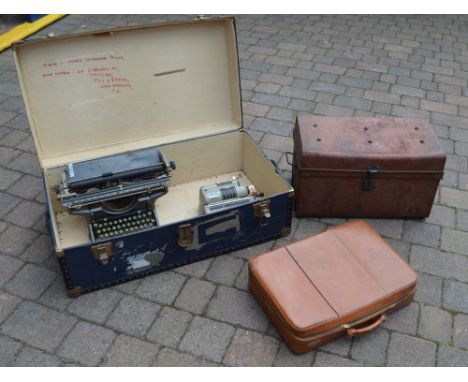 Travelling trunk, tin trunk, leather case, Underwood typewriter and an adding machine