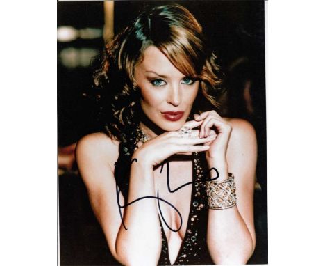 Kylie Minogue signed 10 x 8 colour photo. Gorgeous portrait photo of the pop princess.   Good condition.  All items come with