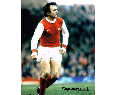 John Hollins Arsenal Signed 10 X 8 inch high quality photograph.   Good condition.  All items come with a Certificate of Auth