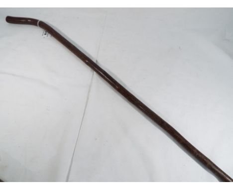 A wooden walking stick / cane with a compass set in the handle. Estimate £20 - £40 This lot MUST be paid for and collected, o