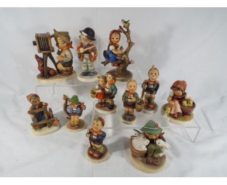 Eleven Goebel Hummel figurines depicting children (qty) This lot MUST be paid for and collected, or delivery arranged, no lat