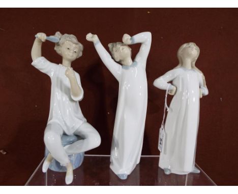 Three good quality ceramic Lladro figurines. (3) Est £20 - £40 This lot MUST be paid for and collected, or delivery arranged,