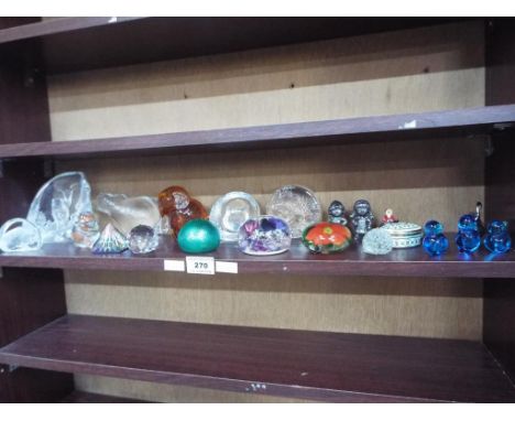 A collection of paperweights to include dome, crystal, a Mats Jonasson, one with an iridescent green finish also included in 