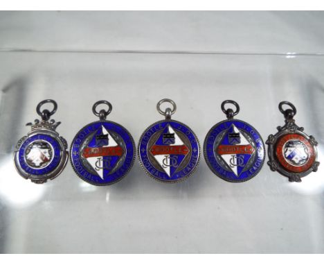 Five silver and enamel hallmarked football medals awarded by Bootle Football League various years, approx 59g total weight. T