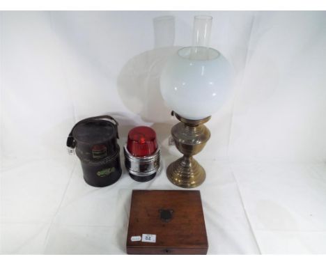 A good lot to include an oil lamp approx 50 cm height, white glass shade, small wooden trinket box, a flashing red emergency 