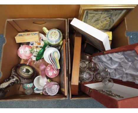 A good mixed lot comprising two boxes to include ceramics, prints, cameras, glassware, a barometer and similar (2) This lot M