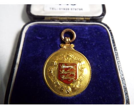 A 9ct gold and enamel runners up medal from the Lancashire FA Amateur Cup awarded to A H Fox for the 1937/8 season, total wei