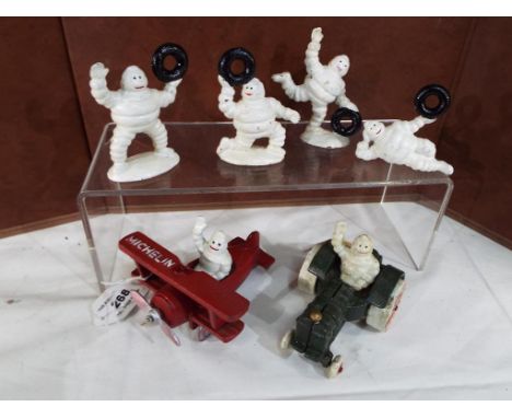 A collection of cast iron advertising items to include plane and tractor with men Est £20 - £30 This lot MUST be paid for and