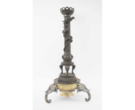 LARGE JAPANESE CANDLESTICK, late 19th century with elephant feet and coiled dragon trunk.