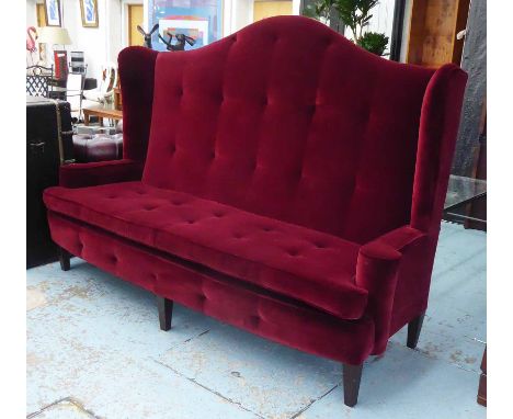 SOFA, having a tall hump back in burgundy upholstery, 225cm L x 160cm H x 85cm W. (with faults/rip to back)