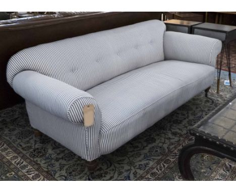 SOFA, Victorian manner oak in ticking upholstery on castors, 194cm W.