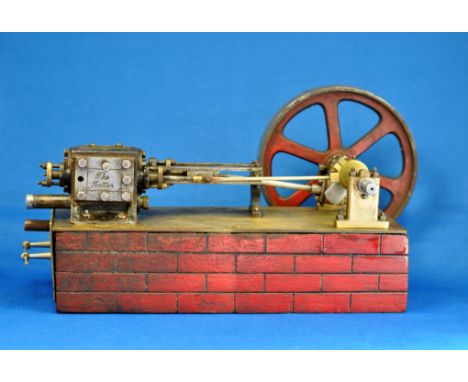 A WELL ENGINEERED SCALE MODEL OF "THE RATTLER" LIVE STEAM BEAM ENGINE WITH LARGE FLY WHEEL MOUNTED ON ITS OWN WOODEN PLYNTH. 