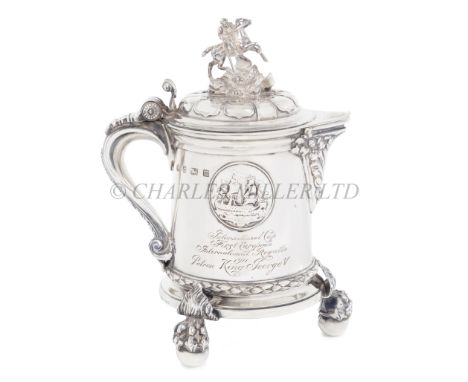 A SILVER RACING TROPHY PRESENTED BY KING GEORGE V AT THE INTERNATIONAL REGATTA, 1911the tankard with spout, scroll handle and