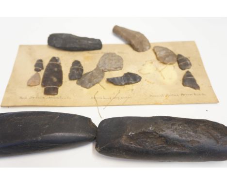 Collection of early arrow heads, flints &amp; axe heads 