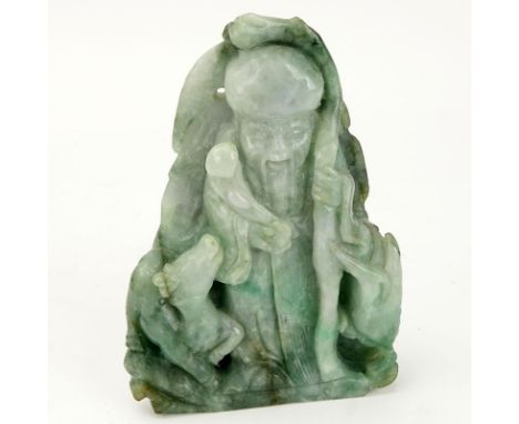 Chinese Carved Jade Shou Lao Figurine. Depicted holding staff and scepter. Light to dark green in color. Natural nicks and in