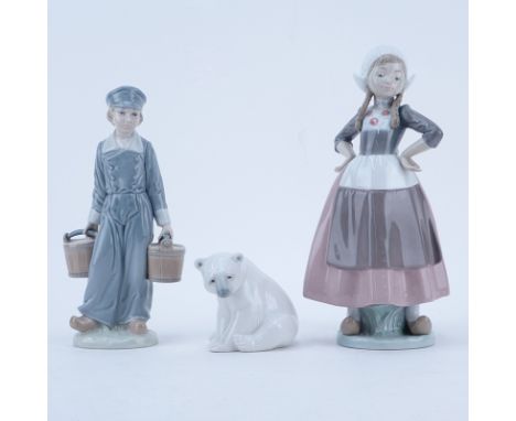 Collection of Three (3) Lladro Porcelain Figurines. Comprise: Gretel with hands akimbo #5064, Dutch Boy with milk buckets, an