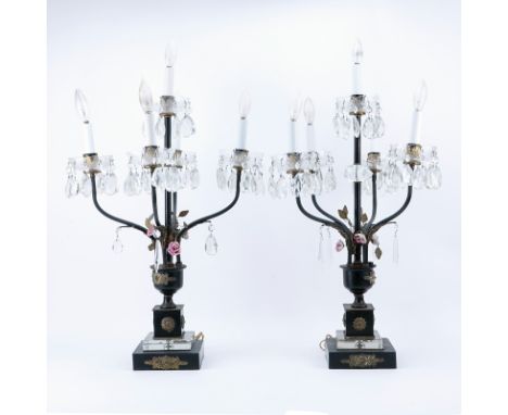 Pair of Empire Style Tole and Gilt Metal 4 Light Candelabra Lamps. Decorated with several hanging prisms and porcelain flower