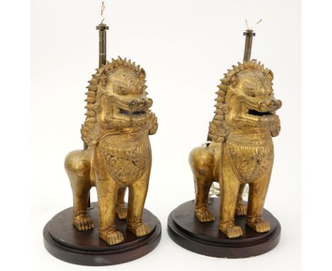 Pair of Vintage Gilt Metal Foo Lion Lamps. Unsigned. Light wear. Measures 14" H from wood base to top of figure. Shipping: Th
