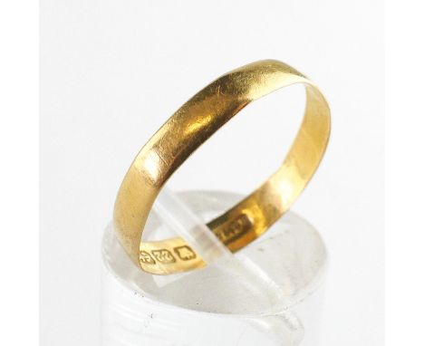 A yellow metal 3.50mm flat profile wedding ring. Hallmarked 22ct gold, Birmingham. Size P 1.3 grams