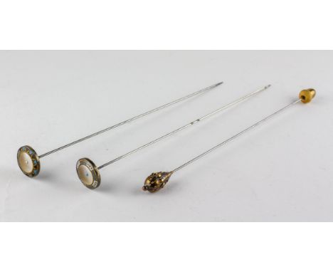 Two hat pins, stamped Sterling Silver, with mother of pearl and enamelled decoration; together with another with a yellow met