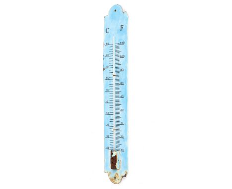 An enamelled tin wall thermometer, marked for centigrade and fahrenheit, 60cm tall