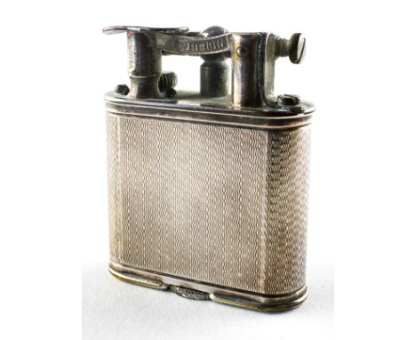 A vintage Dunhill lighter, adorned with engine turned decoration, pat no 288806, 5 cm high 