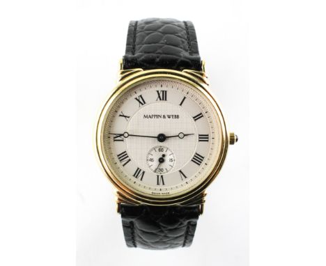 A gold plated mappin and webb 'The Meridian' quartz  wristwatch. Circular dial with roman numerals. Black leather strap. 25.4