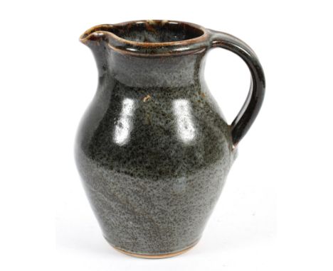 A Muchelney (John Leach) Studio pottery ewer, impressed uppercase mark, glazed in speckled grey/brown glaze, with strap handl