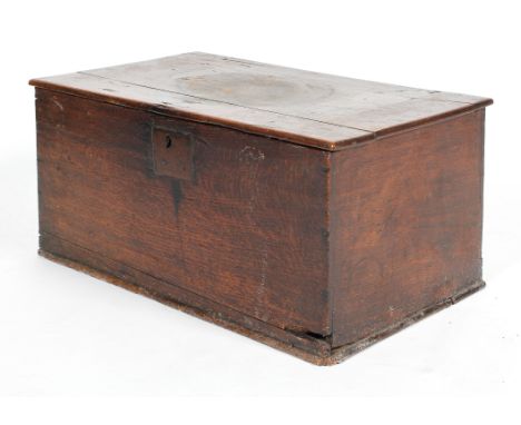 An oak trunk, probably 18th century, the hinged top revealing three partitions, 30 cm high x 64.5 cm wide x 39 cm deep 