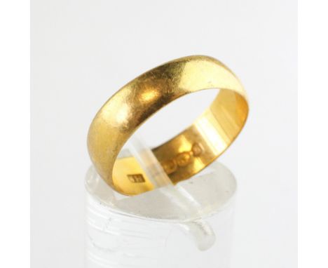 A yellow metal 6mm D shape wedding ring. Hallmarked 22ct gold, Birmingham. Size: O 4.3 grams