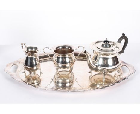 A Walker and Hall EPNS three piece tea set, on tray, stamped marks and numerals, comprising: a baluster teapot and cover , a 