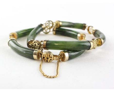 A pair of bracelets of identical design having cylindrical links in the style of nephrite jade and finished with gold plated 