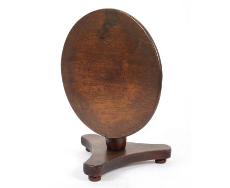 A mahogany miniature or apprentice tilt top table on a tripod base and bun feet, 20 cm high 