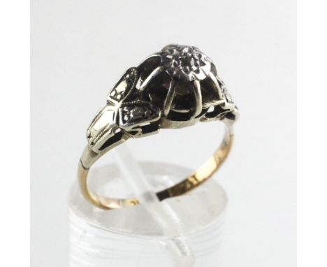 A yellow and white metal ring illusion set with a 0.01ct (estimated) diamond. Stamped 18ct Plat. Size K 3.6 grams