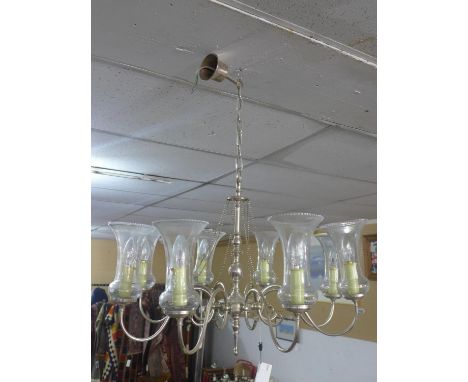 An eight branch chandelier with glass shades 