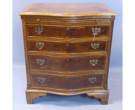 A walnut serpentine chest of 4 graduated drawers with brush slide, having cross-banded top, on bracket feet, H.80 W.70 D.49cm