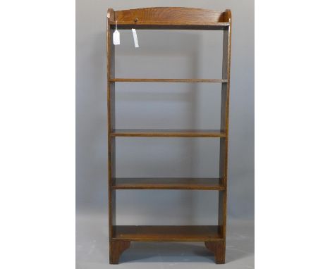 An oak open bookcase, on bracket feet, H.106cm 