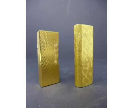 A boxed vintage Dunhill lighter, with original paperwork from 1978, H.6.2cm, together with a vintage Cartier lighter, in asso