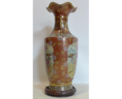 A Japanese Satsuma style vase, decorated with vignettes of figures, flowers and birds on an orange/red ground with stylised f