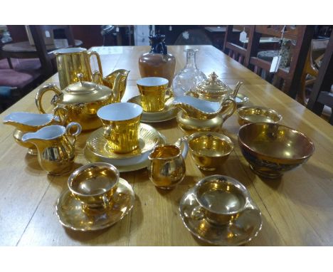 A collection of gilt lusterwear porcelain to include Royal Worcester, together with a Mary Gregory painted vase and a Doulton