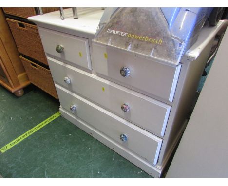 White painted pine chest of four drawers with ceramic handles.