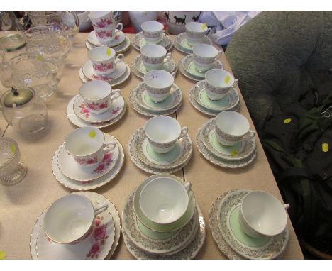 Bone china cups and saucers with floral borders with Salisbury bone china cups and saucers decorated with roses. As found