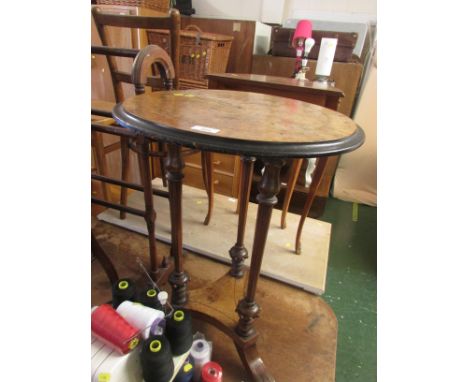 Mahogany and walnut veneered boxwood strung wine table supported on three columns with tripod feet.