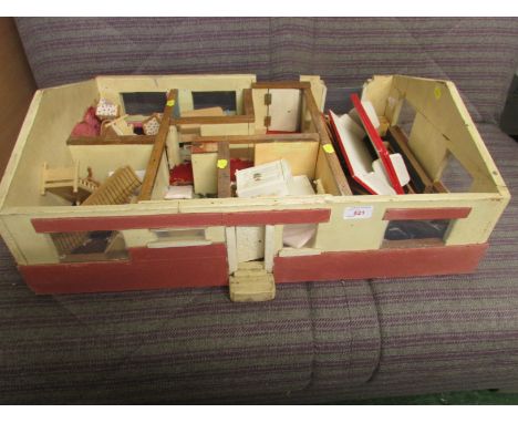 VINTAGE PAINTED WOODEN DOLL'S BUNGALOW WITH CONTENTS OF ASSORTED WOODEN AND PLASTIC FURNITURE. AS FOUND.