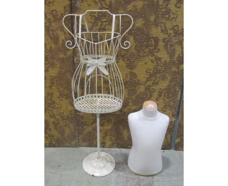 A  painted decorative light metal child's size mannequin raised on a circular base together with one other (2) 
